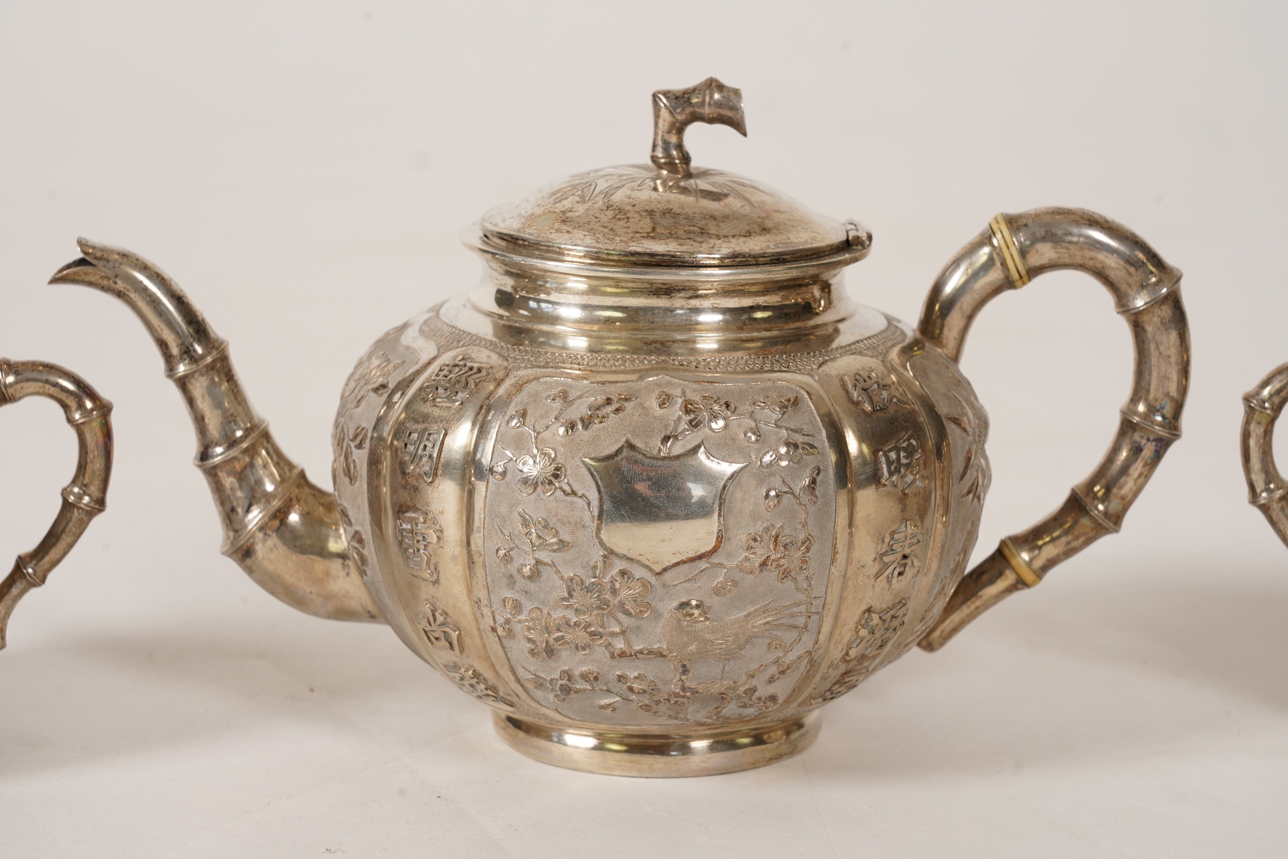 A late 19th/early 20th century Chinese Export white metal three-piece tea set, maker's mark WA